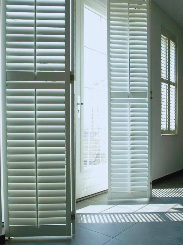 white wooden shutter blinds