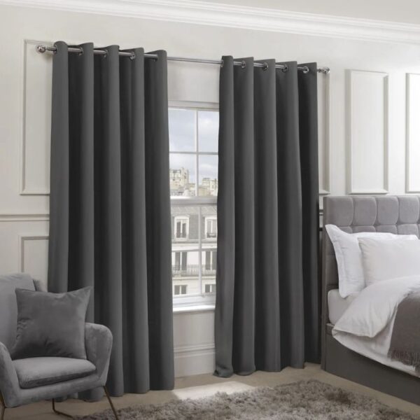 Cali Charcoal Grey Blackout Eyelet Curtains Hanging In Living Room