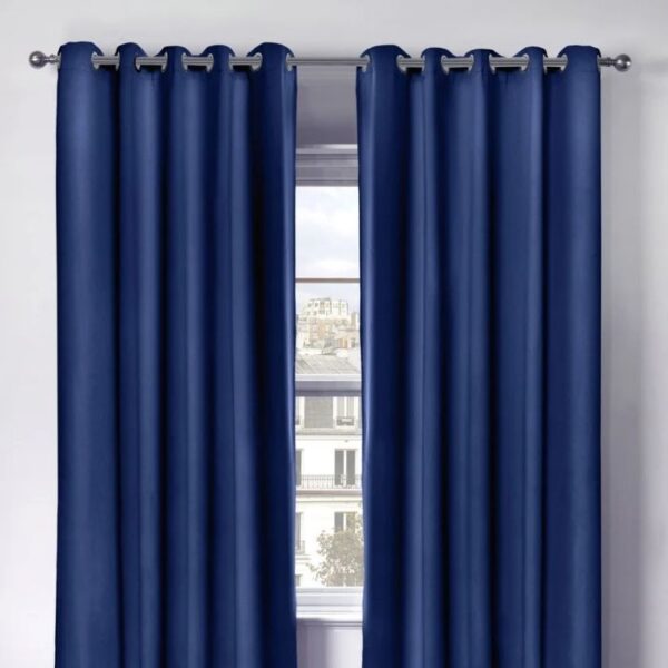 Cali Navy Blue Blackout Eyelet Curtains Hanging In Room