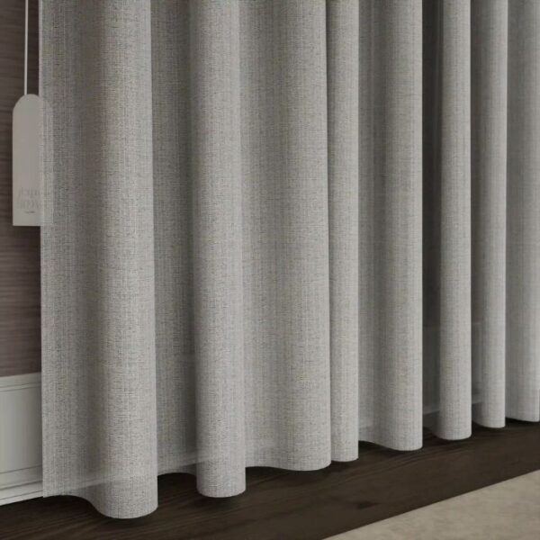 Daylight Filtering Through Beige Sheer Pleat Curtains