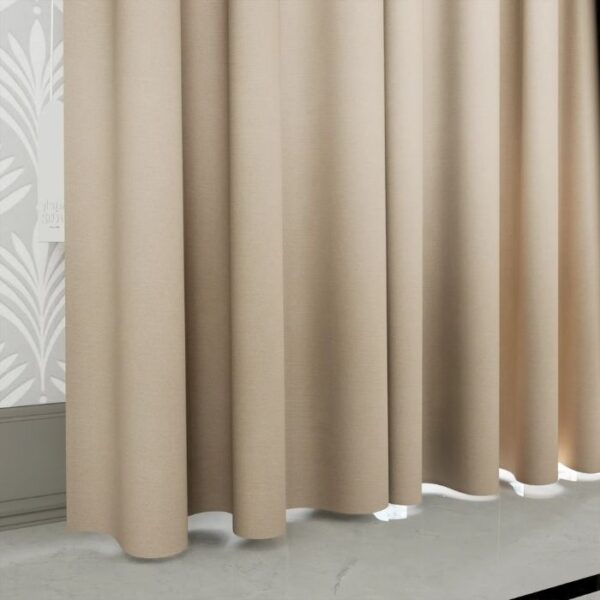 Daylight Filtering Through Brown Pleat Curtain