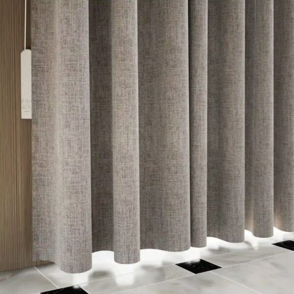 Daylight Filtering Through Grey Blackout Pleat Curtains