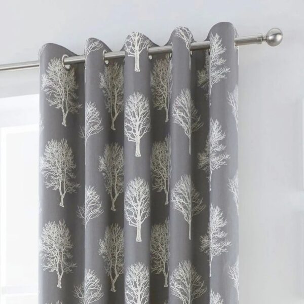 Close-Up Of Tree Print And Eyelet Finish On Grey Curtains