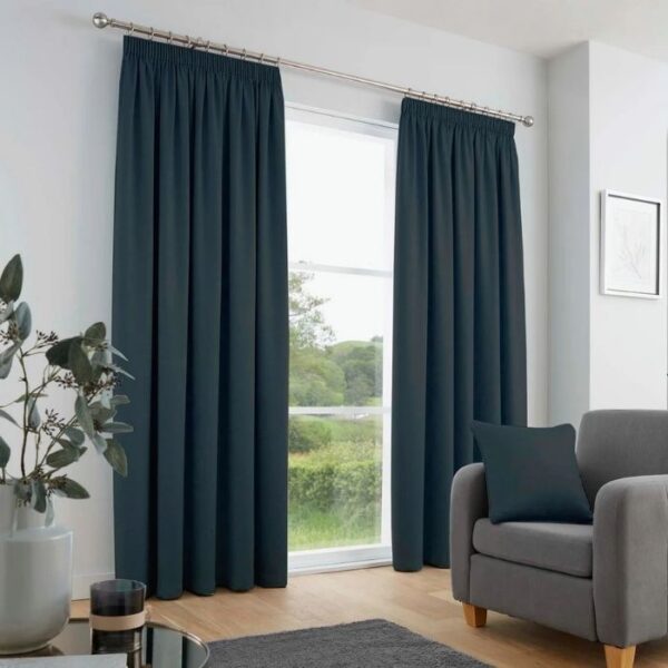 Galaxy Navy Blue Dim Out Pleat Curtains Hanging In Room
