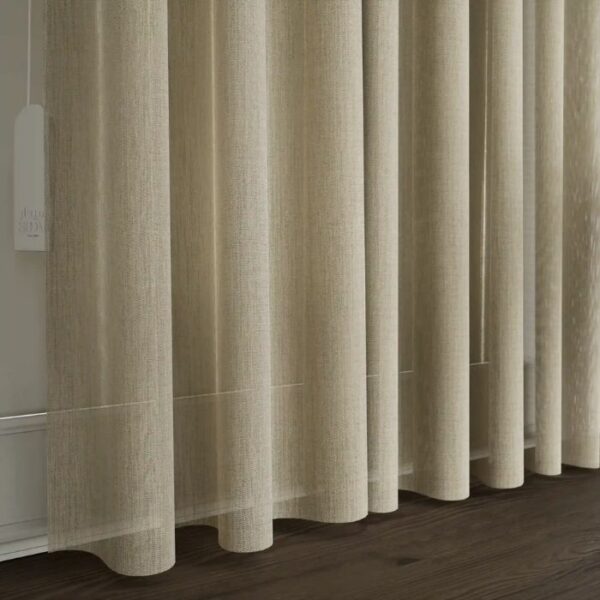 Light Filtering Through Light Brown Sheer Curtain