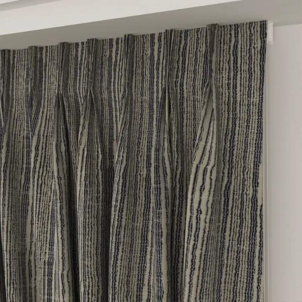 Pinch Pleat Detail On Blue Fabric Curtain