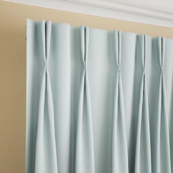 Pinch Pleat Detail On Light Blue Curtain